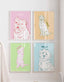 Gallery wall of four colourful line drawing dog portraits, bulldog, retriever, puppy and fluffy terrier