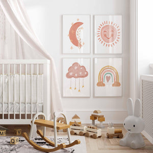 Pastel sun, moon, cloud and rainbow prints as a grid of four above a crib