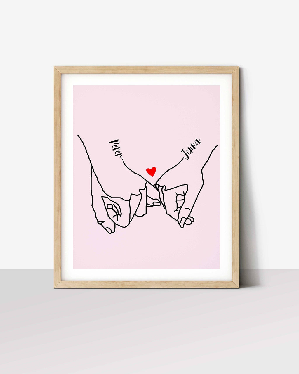 Pinky promise print: line drawing of two linked pinky fingers with names Peter and Jenna and a red heart, on pink