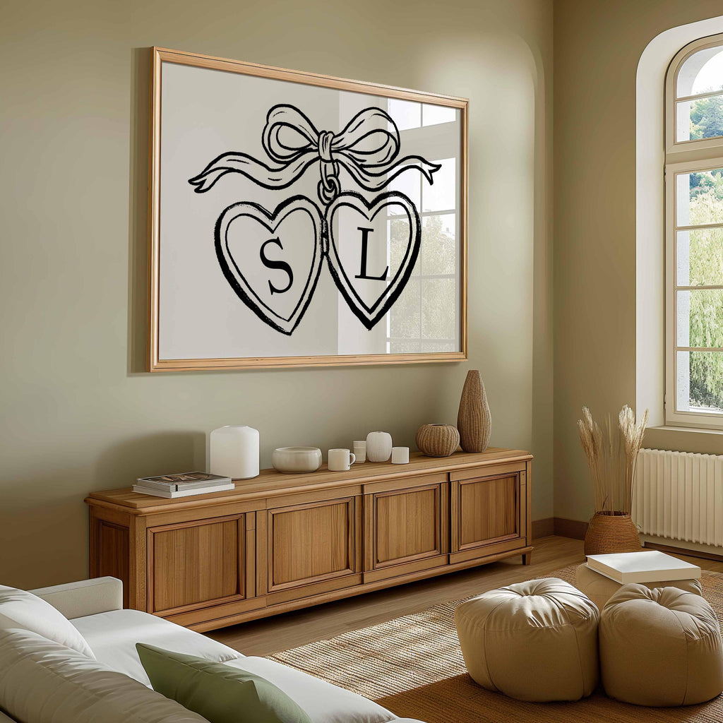 Heart locket couple print with initials S and L in two hearts tied with a bow, above a wooden sideboard