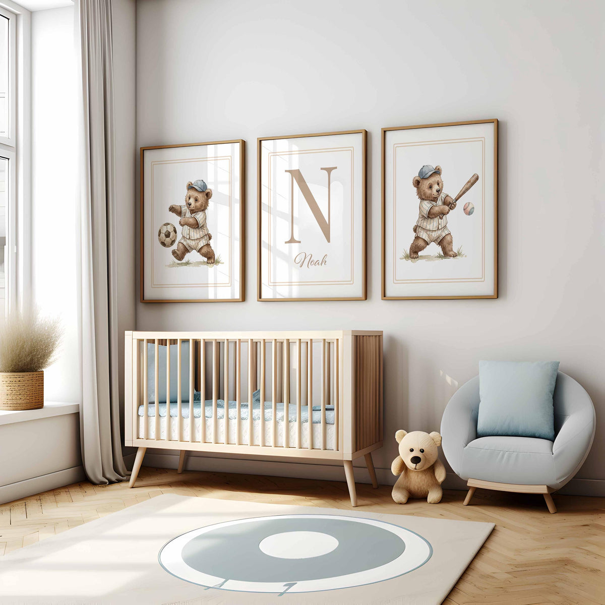 Teddy sports initial set above a crib and blue armchair