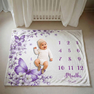 Purple butterfly milestone blanket with a smiling baby on a nursery floor