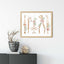 Landscape dental tools print in a wooden frame above a sideboard